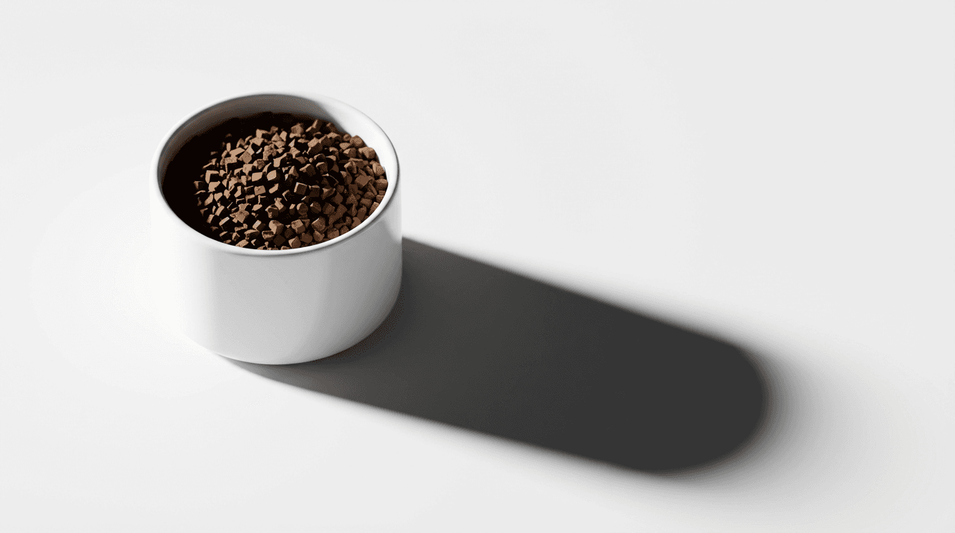 Minimal product photography of a coffee bag and mug on concrete